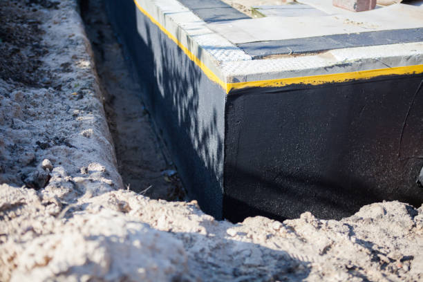 Professional Waterproofing technician working in Dresden, NY